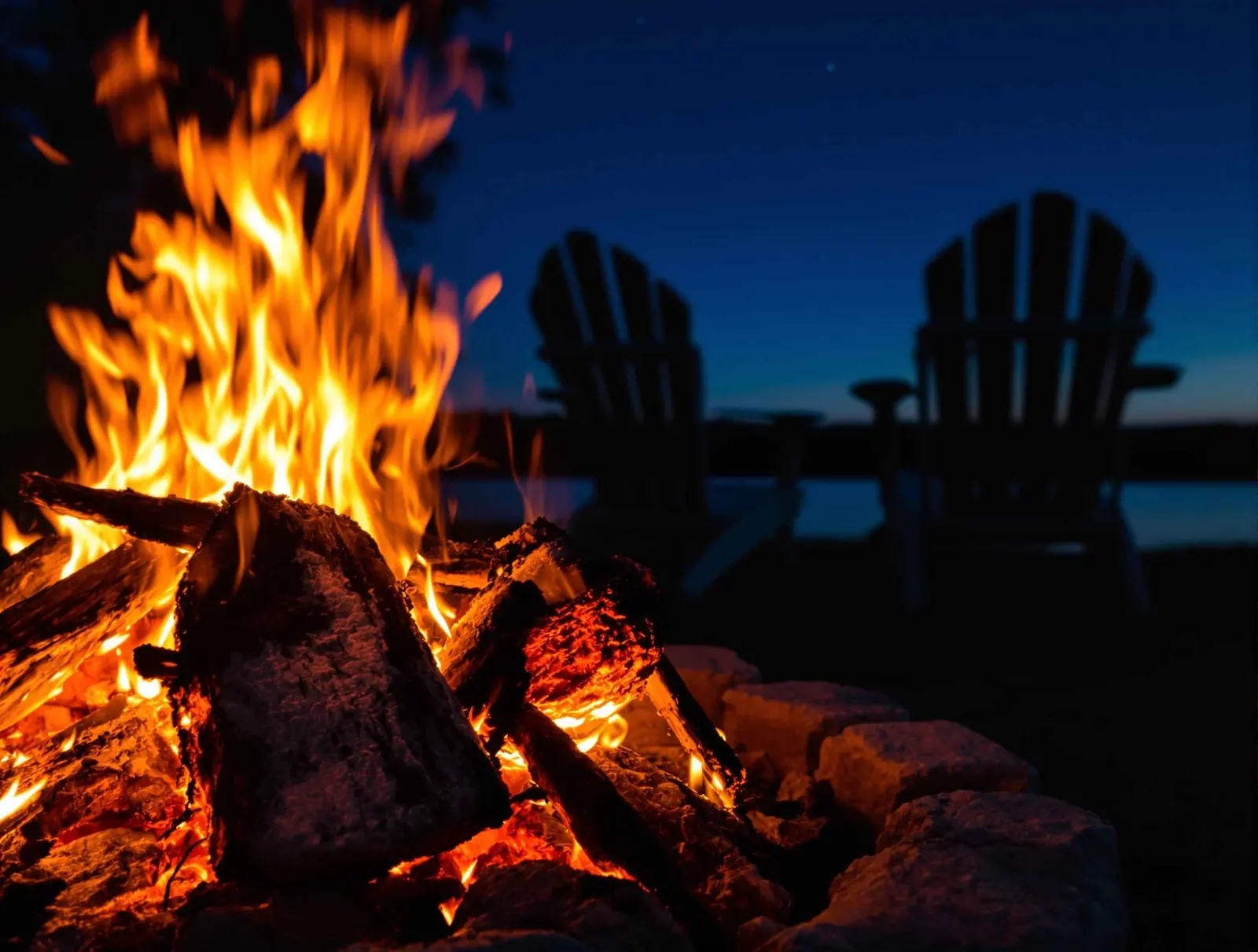 Lakeside campfire under stars
